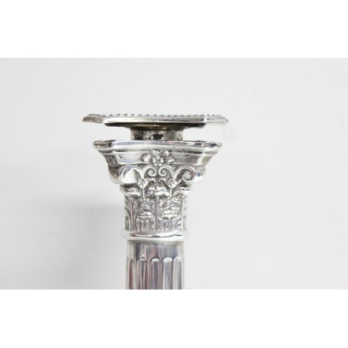 1005 - A pair of large and impressive silver Corinthian column candlesticks, marked for Birmingham 1935, ea... 