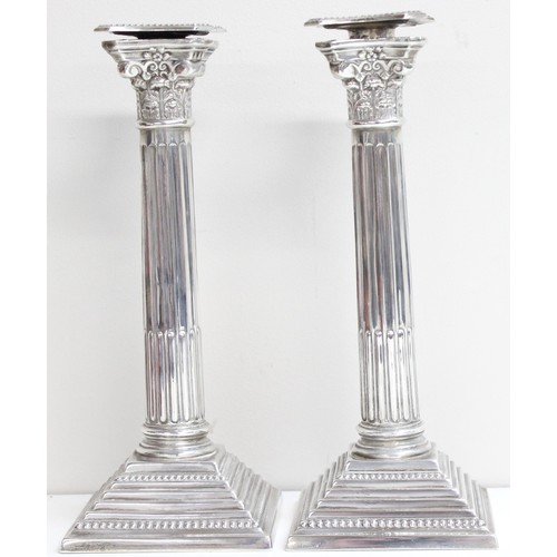 1005 - A pair of large and impressive silver Corinthian column candlesticks, marked for Birmingham 1935, ea... 