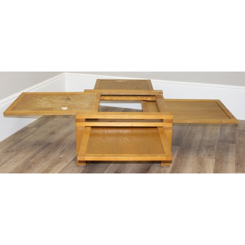 16 - An unusual retro style 4-way extendable coffee table, approx 70cm wide (190cm fully extended) x 70cm... 