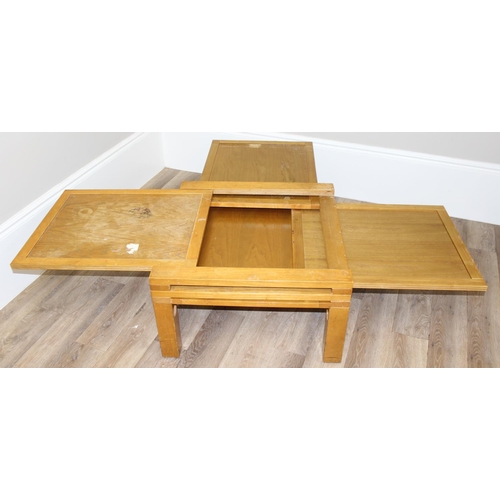 16 - An unusual retro style 4-way extendable coffee table, approx 70cm wide (190cm fully extended) x 70cm... 