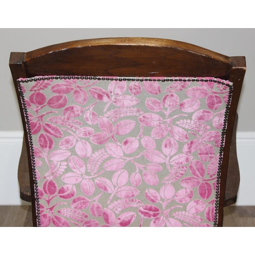 23 - An antique plantation chair with turned legs and later retro style pink floral upholstery, approx 10... 