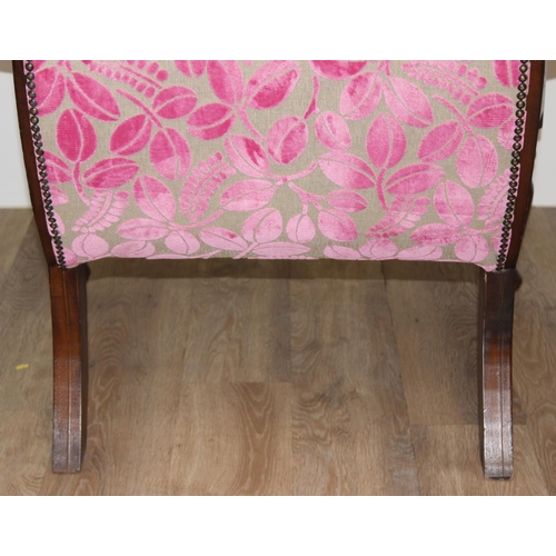 23 - An antique plantation chair with turned legs and later retro style pink floral upholstery, approx 10... 