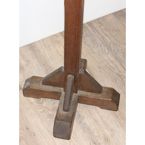 25 - A vintage oak lectern with carved details, approx 40cm wide x 40cm deep x 124cm tall