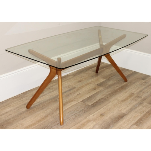 29 - A retro style glass topped dining table with shaped wooden base, approx 181cm x 100cm x 75cm