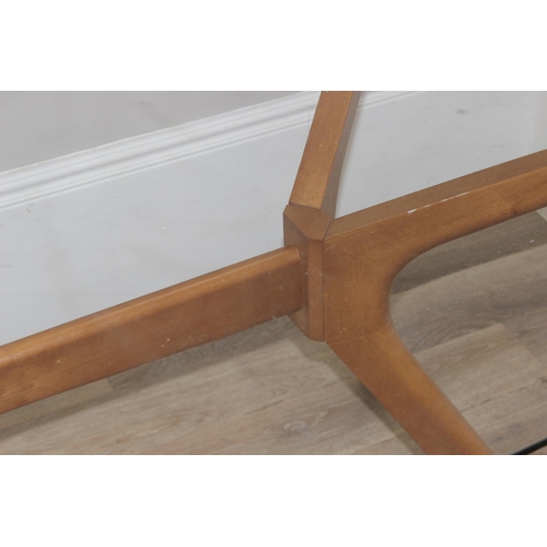 29 - A retro style glass topped dining table with shaped wooden base, approx 181cm x 100cm x 75cm