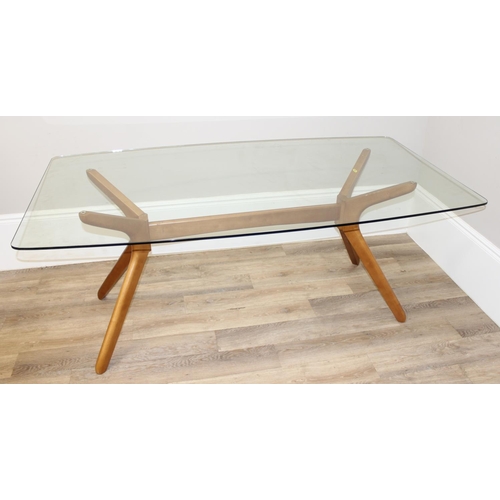 29 - A retro style glass topped dining table with shaped wooden base, approx 181cm x 100cm x 75cm