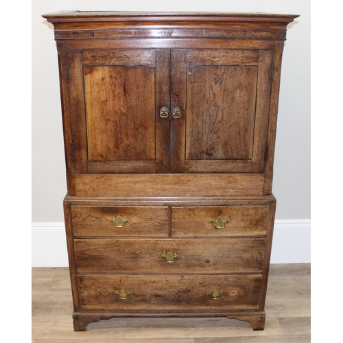 30 - An antique oak cabinet on chest, 2 over 2 chest base with cabinet top, likely 19th century, with ori... 