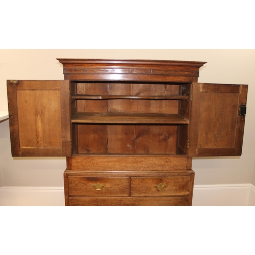 30 - An antique oak cabinet on chest, 2 over 2 chest base with cabinet top, likely 19th century, with ori... 