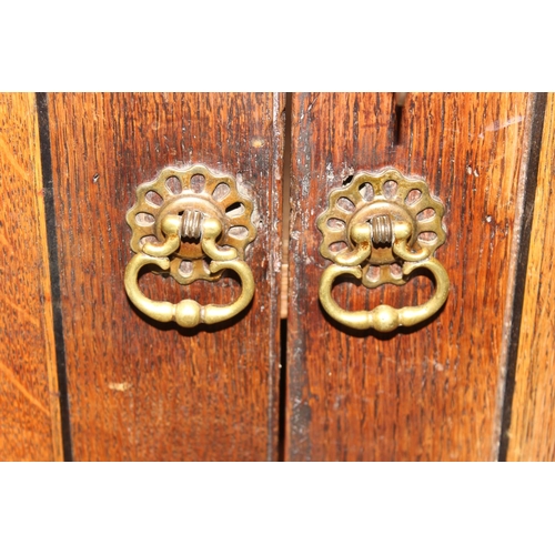 30 - An antique oak cabinet on chest, 2 over 2 chest base with cabinet top, likely 19th century, with ori... 