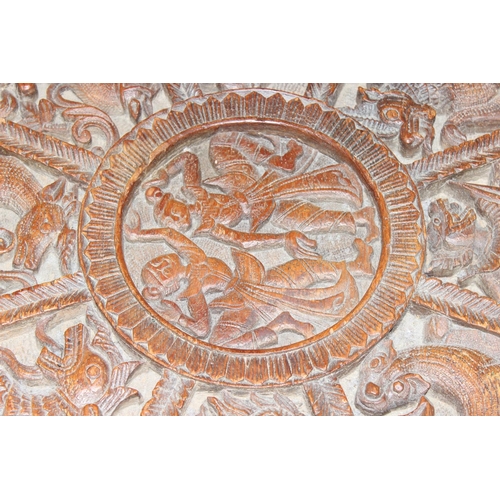 36 - A South Asian carved hardwood folding octagonal topped table with folding wooden base, approx 61cm i... 