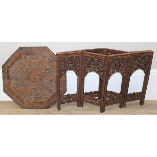 36 - A South Asian carved hardwood folding octagonal topped table with folding wooden base, approx 61cm i... 