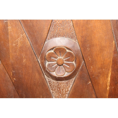 43 - A vintage wooden spinning chair with carved back, approx 107cm tall