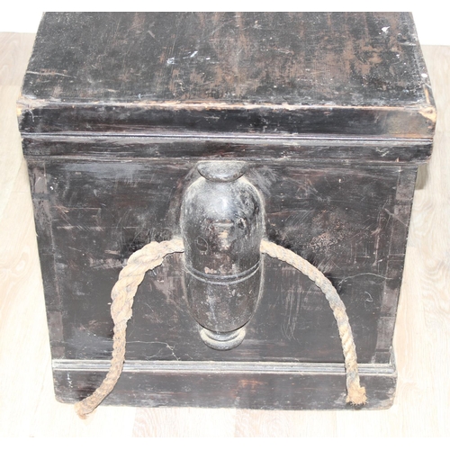 51 - A large antique black painted pine trunk, likely a naval tool box with rope handles, named to interi... 