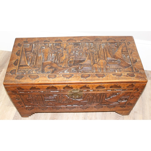 54 - An Oriental carved camphorwood chest, early-mid 20th century, approx 88cm wide x 44cm deep x 52cm ta... 