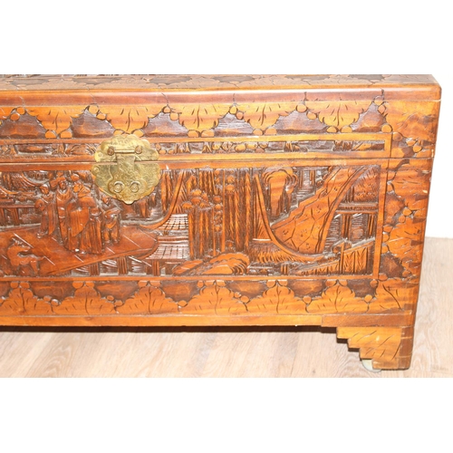 54 - An Oriental carved camphorwood chest, early-mid 20th century, approx 88cm wide x 44cm deep x 52cm ta... 
