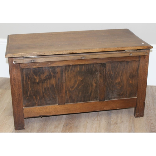 7 - An antique style oak coffer with carved detailing, approx 90cm wide x 46cm deep x 52cm tall