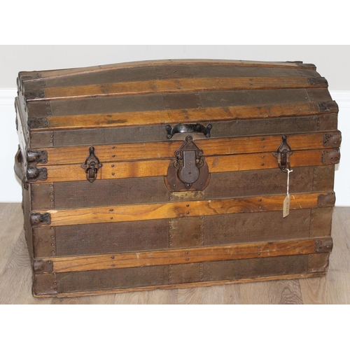 8 - An antique dome-topped chest or shipping trunk with wooden slats and iron fittings, approx 76cm wide... 