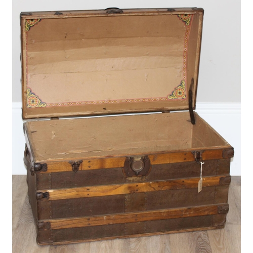 8 - An antique dome-topped chest or shipping trunk with wooden slats and iron fittings, approx 76cm wide... 