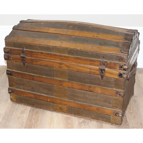 8 - An antique dome-topped chest or shipping trunk with wooden slats and iron fittings, approx 76cm wide... 