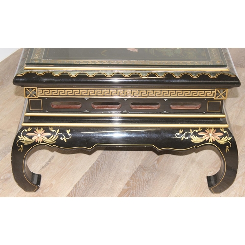 9 - An Oriental black lacquer and floral decorated coffee table, approx 123cm wide x 66cm deep x 47cm ta... 