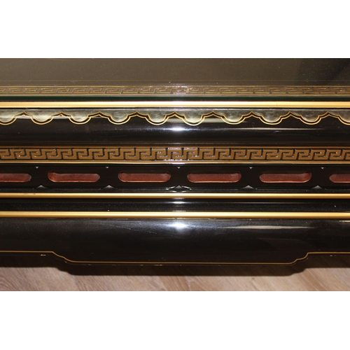 9 - An Oriental black lacquer and floral decorated coffee table, approx 123cm wide x 66cm deep x 47cm ta... 