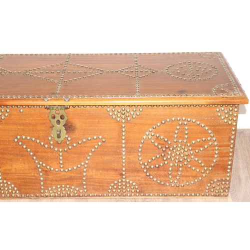5 - A vintage brass studded hardwood Zanzibar chest, profusely decorated with brass studs, likely early ... 