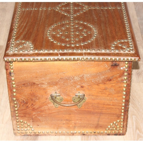 5 - A vintage brass studded hardwood Zanzibar chest, profusely decorated with brass studs, likely early ... 