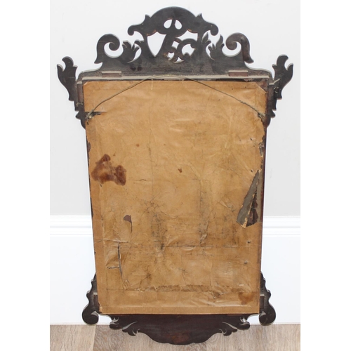 549R - A Georgian mahogany framed fretwork wall mirror with carved gilt eagle, approx 92cm x 53cm