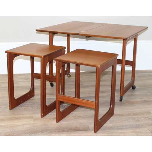 48 - A.H. Mcintosh, A Mid-Century Triform nest of tables, the largest table with a folding revolving top,... 