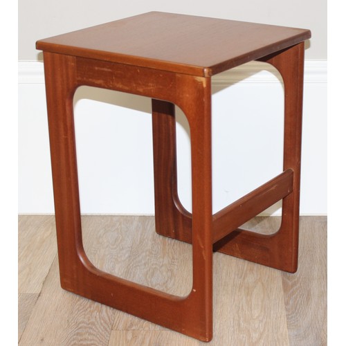 48 - A.H. Mcintosh, A Mid-Century Triform nest of tables, the largest table with a folding revolving top,... 