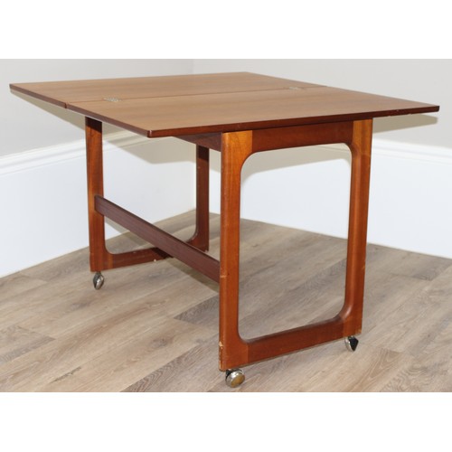 48 - A.H. Mcintosh, A Mid-Century Triform nest of tables, the largest table with a folding revolving top,... 