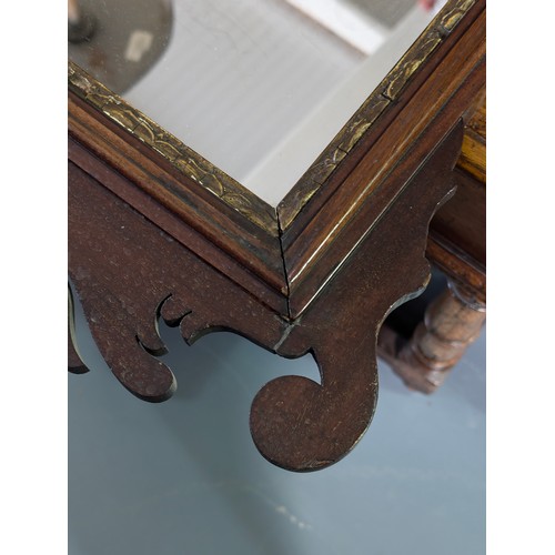 549R - A Georgian mahogany framed fretwork wall mirror with carved gilt eagle, approx 92cm x 53cm