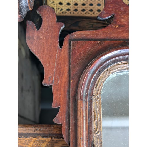 549R - A Georgian mahogany framed fretwork wall mirror with carved gilt eagle, approx 92cm x 53cm