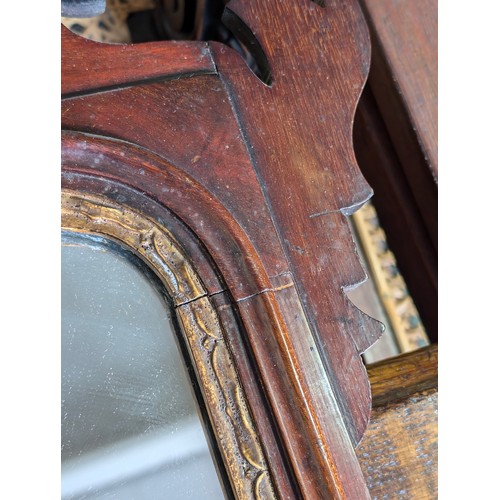 549R - A Georgian mahogany framed fretwork wall mirror with carved gilt eagle, approx 92cm x 53cm