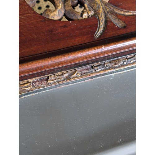 549R - A Georgian mahogany framed fretwork wall mirror with carved gilt eagle, approx 92cm x 53cm