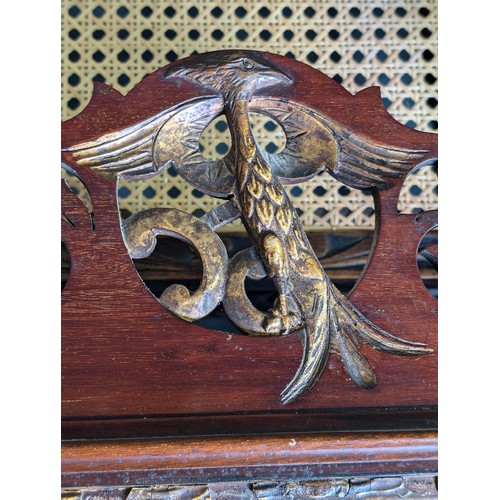 549R - A Georgian mahogany framed fretwork wall mirror with carved gilt eagle, approx 92cm x 53cm