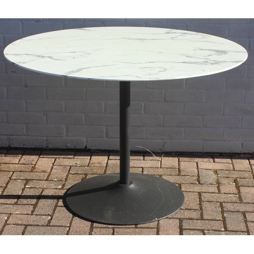 315 - A marble effect round topped garden table with metal base, approx 110cm in diameter x 75cm tall