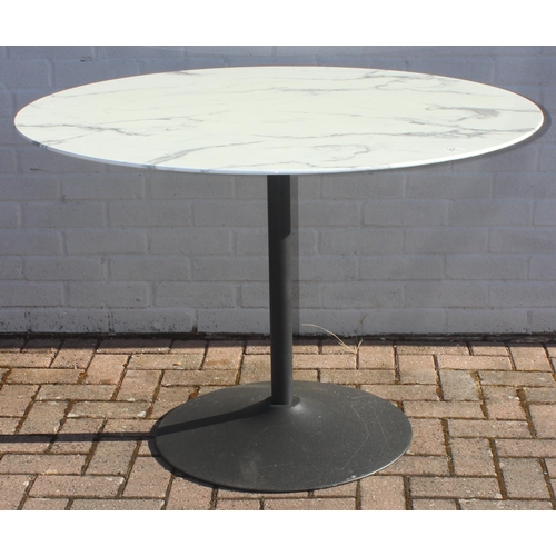 315 - A marble effect round topped garden table with metal base, approx 110cm in diameter x 75cm tall