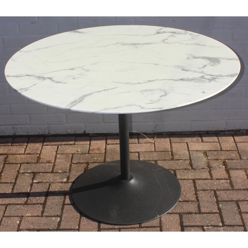 315 - A marble effect round topped garden table with metal base, approx 110cm in diameter x 75cm tall