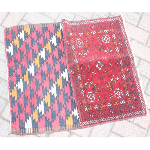 213 - 2 donkey bag style rugs, one with kilim back, the largest approx 65cm x 48cm