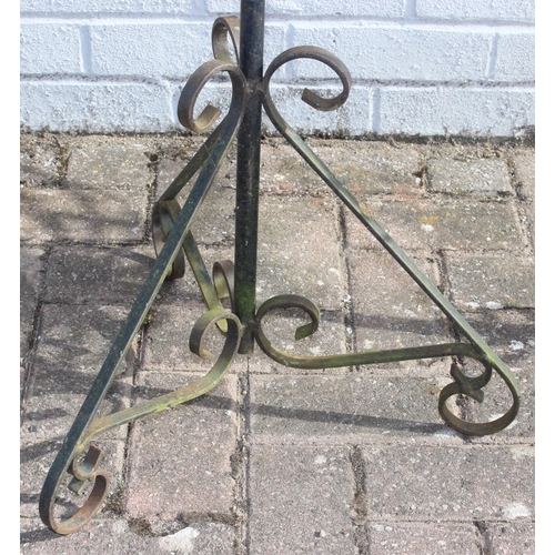 321 - 2 wrought iron garden planters of different designs, largest approx 83cm tall