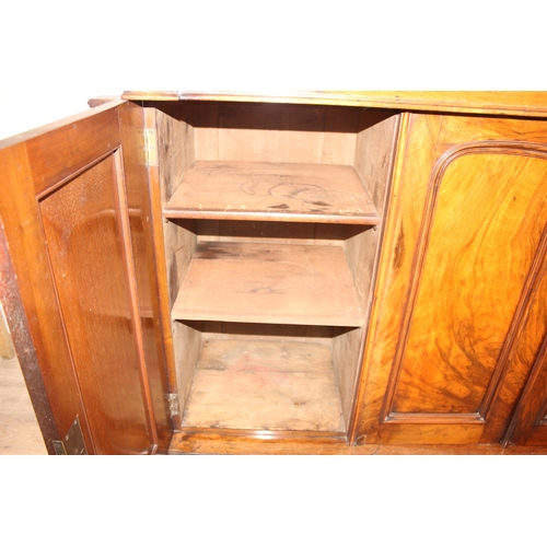 169 - A Victorian mahogany chiffonier or sideboard with mirror shelf and 3 door base, approx 131cm wide x ... 