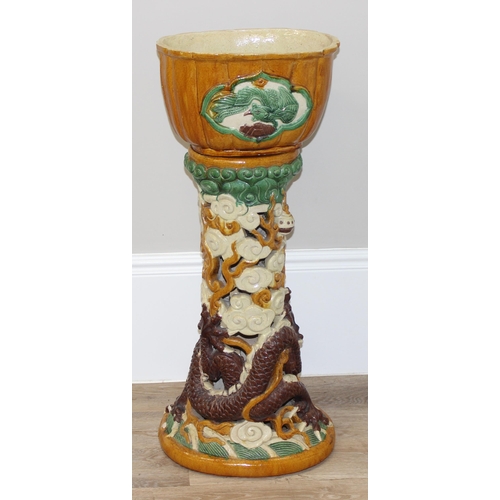 323 - A colourful Chinese stoneware jardiniere on stand, the base formed as a dragon, approx 38cm wide x 2... 