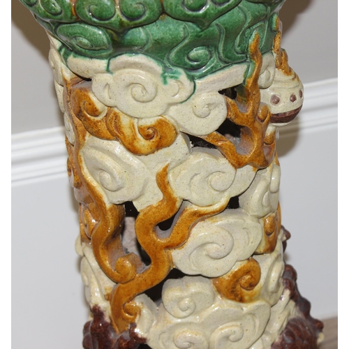 323 - A colourful Chinese stoneware jardiniere on stand, the base formed as a dragon, approx 38cm wide x 2... 