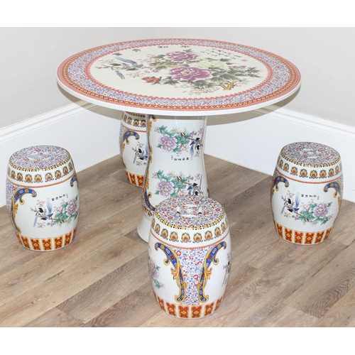 322 - Highly decorative Chinese porcelain garden table with Oriental design and 4 stools, table approx 93c... 