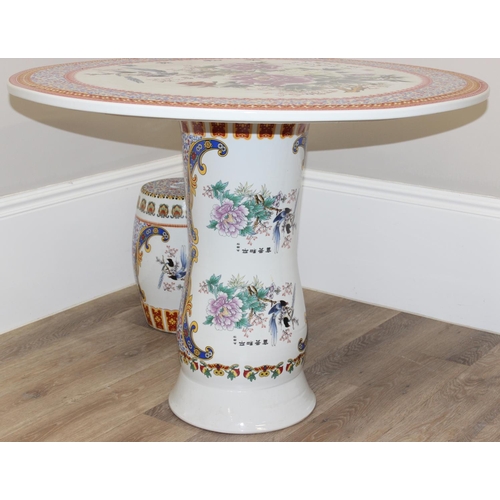 322 - Highly decorative Chinese porcelain garden table with Oriental design and 4 stools, table approx 93c... 