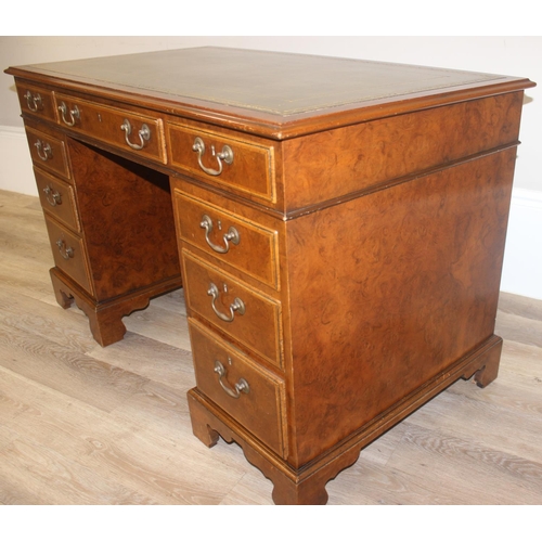 11 - A quality antique style pedestal desk with green inset gilt tooled leather top, walnut or yew wood w... 