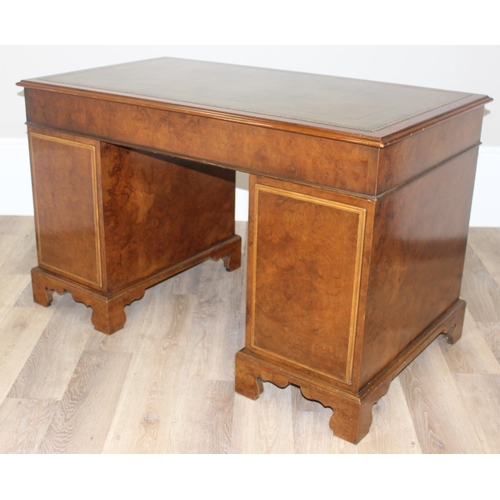 11 - A quality antique style pedestal desk with green inset gilt tooled leather top, walnut or yew wood w... 