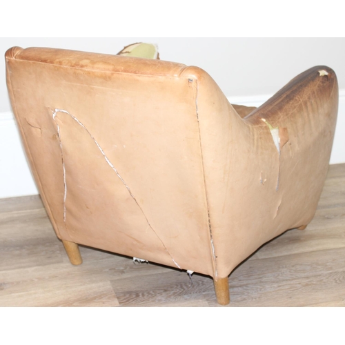 13 - A pair of Balzac club or armchairs in tan leather and a matching footstool, designed by Matthew Hilt... 