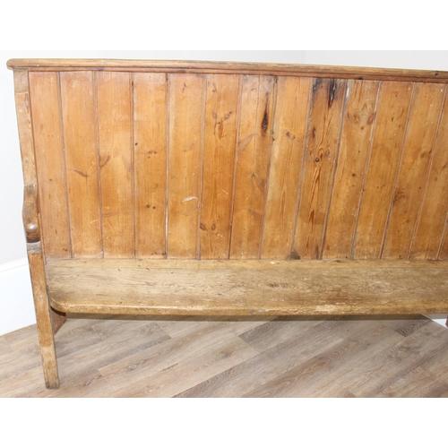 2 - An unusual antique pine pew or bench with high panelled back, one end shaped for corner, likely 19th... 